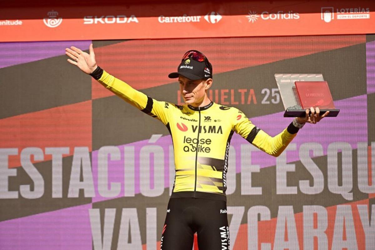 Team Visma-Lease a bike's Danish rider Jonas Vingegaard celebrates on stage after winning the 9th stage of the Vuelta a Espana, a 195 km race between Alfaro and Valdezcaray, on August 31, 2025. ANDER GILLENEA / AFP
