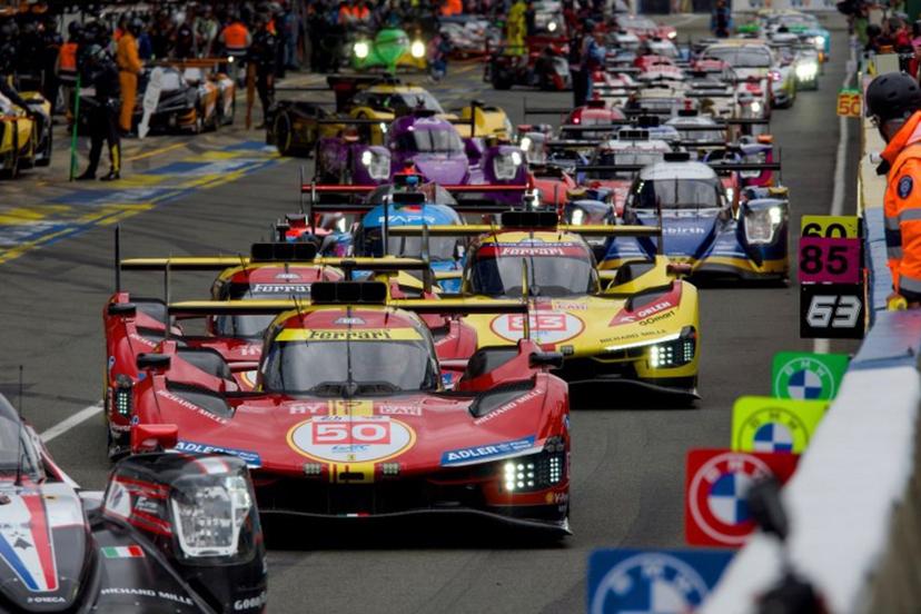 Drivers prepare to take the start of the 24 Hours of Le Mans endurance race, which is part of the FIA World Endurance Championship (WEC), in Le Mans, Western France, on June 15, 2024. GUILLAUME SOUVANT / AFP