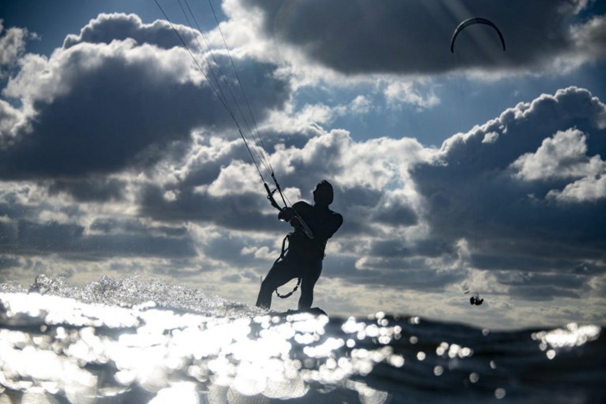 A kitesurfer catches air of the coast in Lège-Cap Ferret, southwestern France on June 8 2020. Olivier MORIN / AFP