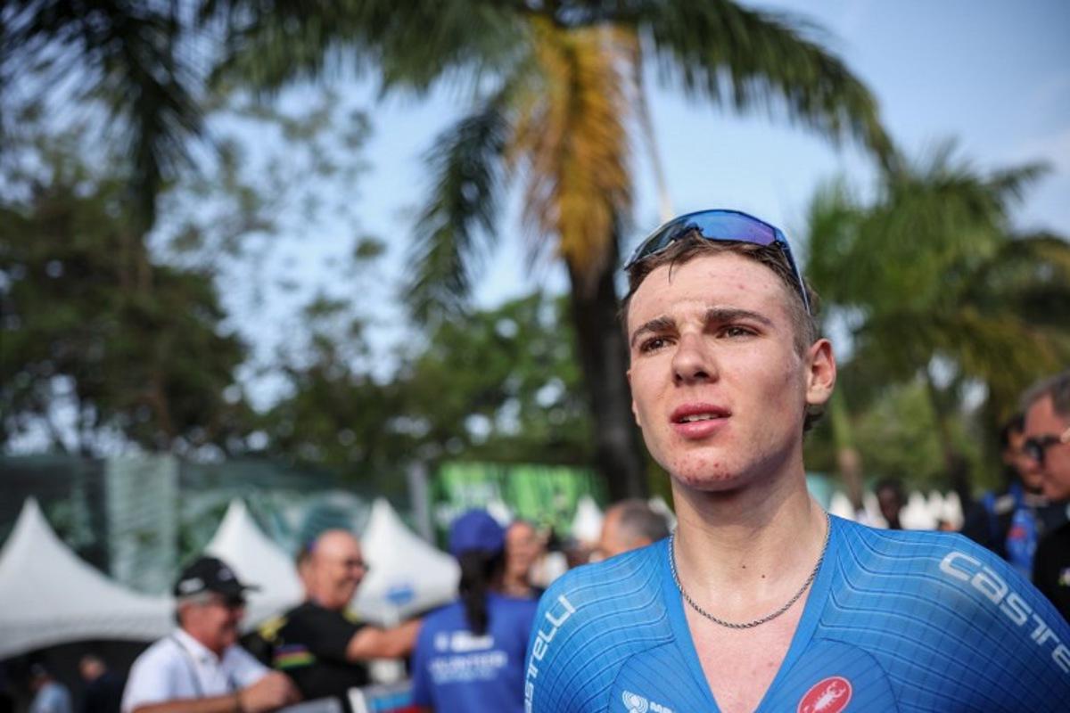 Italian rider Lorenzo Mark Finn reacts after winning the men's U23 road race cycling event during the UCI 2025 Road World Championships, in Kigali, on September 26, 2025. Anne-Christine POUJOULAT / AFP