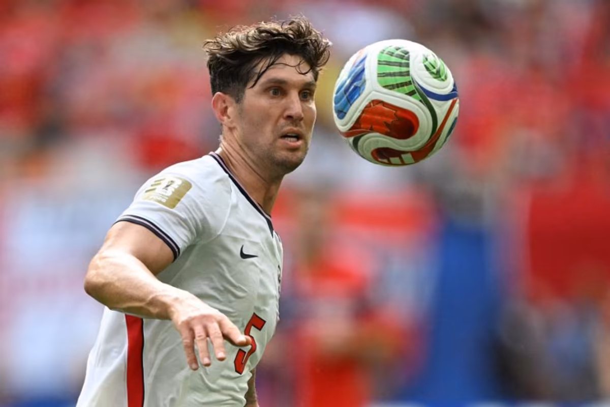 England's defender #05 John Stones looks at the ball during the 2026 World Cup football tournament quarter-final match between Norway and England at Miami Stadium in Miami Gardens on July 11, 2026. MAURO PIMENTEL / AFP