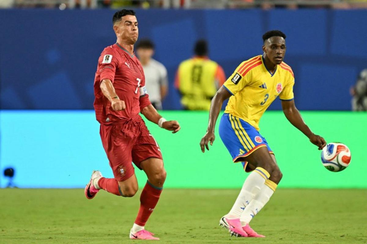Portugal's forward #07 Cristiano Ronaldo and Colombia's defender #03 Jhon Lucumi fight for the ball during the 2026 World Cup Group K football match between Colombia and Portugal at the Miami Stadium in Miami Gardens on June 27, 2026. CHANDAN KHANNA / AFP