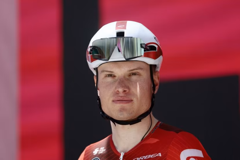 Lotto Intermarche Belgian rider Lennert Van Eetvelt stands on the signature podium before the 8th stage of the Giro d'Italia 2026 - Tour of Italy cycling race between Chieti and Fermo, central Italy on May 16, 2026. Luca Bettini / AFP