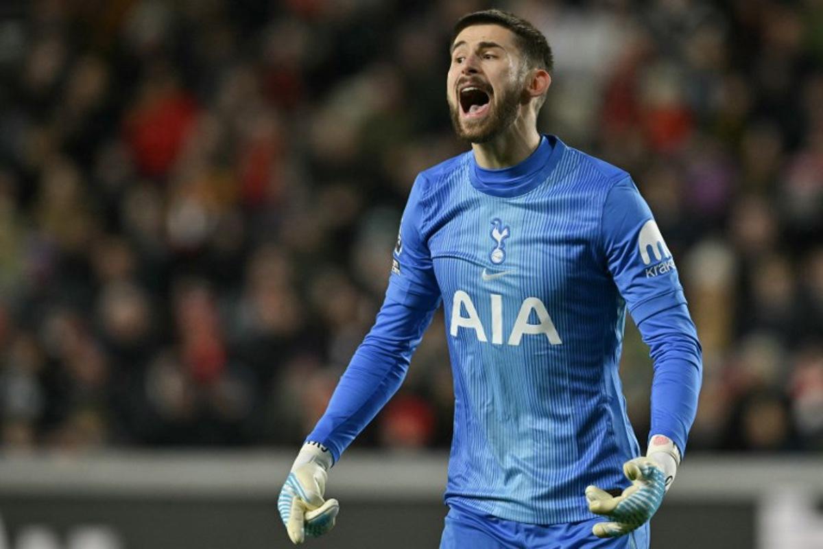 Tottenham Hotspur's Italian goalkeeper #01 Guglielmo Vicario reacts during the English Premier League football match between Brentford and Tottenham Hotspur at the Gtech Community Stadium in London on January 1, 2026. Glyn KIRK / AFP