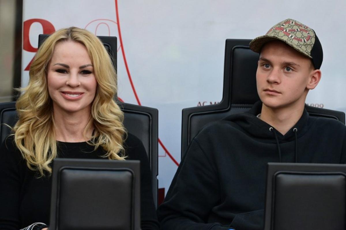The wife of AC Milan's Swedish forward Zlatan Ibrahimovic, Helena Seger (L) and their son son Maximilian Ibrahimovic looks on at the start of the Italian Serie A football match between AC Milan and Atalanta Bergamo at the San Siro stadium in Milan on May 15, 2022. MIGUEL MEDINA / AFP