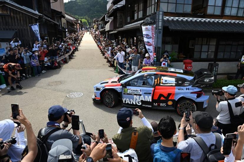 Thierry Neuville of Belgium and his co-driver Martijn Wydaeghe of Belgium drive their Hyundai i20 N Rally1 on the traditional Japanese townscape of Iwamura during the Rally Japan, the 7th round of the FIA World Rally Championships in Ena city, Gifu prefecture on May 30, 2026. Toshifumi KITAMURA / AFP