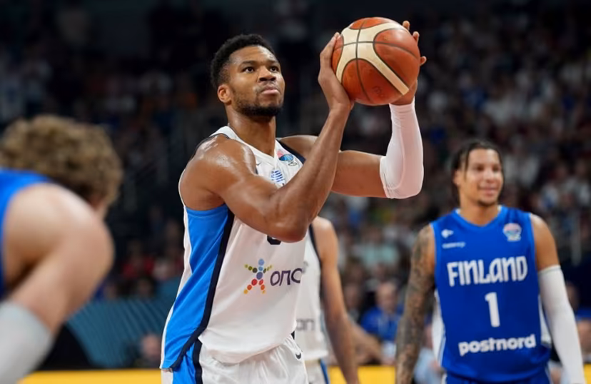 Greece's small forward #34 Giannis Antetokounmpo (C) holds the ball during the FIBA EuroBasket 2025 third place basketball match between Greece and Finland in Riga, Latvia, on September 14, 2025. Gints Ivuskans / AFP