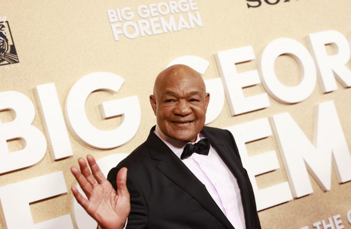 (FILES) Retired pro-boxer George Foreman arrives for the world premiere of "Big George Foreman: The Miraculous Story of the Once and Future Heavyweight Champion of the World," at Regal LA Live in Los Angeles, California, on April 26, 2023. Former heavyweight boxing champion George Foreman, who fought an iconic battle with Muhammad Ali before later reclaiming the title two decades later, died March 21 aged 76, his family announced in a statement. "With profound sorrow, we announce the passing of our beloved George Edward Foreman Sr, who peacefully departed on March 21, 2025, surrounded by loved ones," the statement said. Michael Tran / AFP