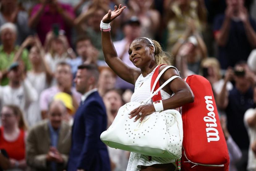 US player Serena Williams waves as he leaves the court after being defeated by Australia's Maya Joint during their women's singles first round tennis match on the second day of the 2026 Wimbledon Championships at The All England Lawn Tennis and Croquet Club in Wimbledon, southwest London, on June 30, 2026. HENRY NICHOLLS / AFP