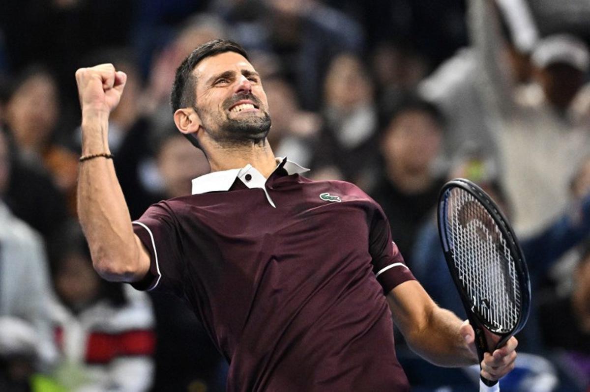 Serbia's Novak Djokovic celebrates his victory against China's Bu Yunchaokete during their men's singles match at the China Open tennis tournament in Beijing on October 2, 2026. Pedro PARDO / AFP