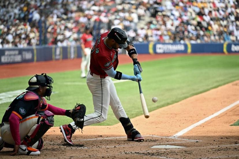 Arizona Diamondbacks' #12 Lourdes Gurriel Jr. swings in front of San Diego Padres' #12 Luis Campusano during the MLB World Tour Mexico City Series game between the Arizona Diamondbacks and the San Diego Padres at Alfredo Harp Helu Stadium in Mexico City on April 26, 2026. YURI CORTEZ / AFP