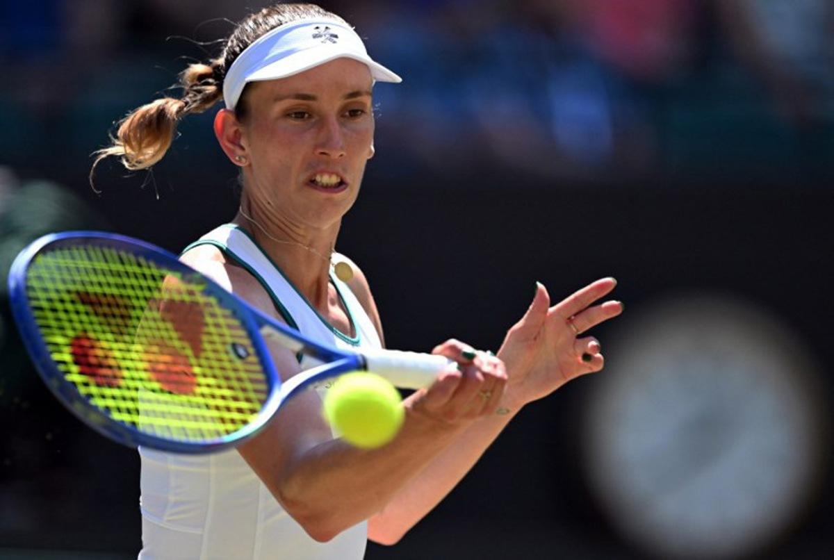 Belgium's Elise Mertens returns to Czech Republic's Linda Noskova during their women's singles quarter-final tennis match on the tenth day of the 2026 Wimbledon Championships at The All England Lawn Tennis and Croquet Club in Wimbledon, southwest London, on July 8, 2026. Kirill KUDRYAVTSEV / AFP
