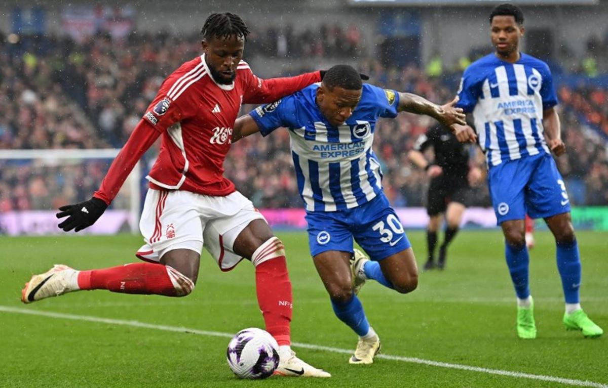 Brighton's Ecuadorian defender #30 Pervis Estupinanm (R) vies with Nottingham Forest's Belgian striker #27 Divock Origi during the English Premier League football match between Brighton and Hove Albion and Nottingham Forest at the American Express Community Stadium in Brighton, southern England on March 10, 2024. Glyn KIRK / AFP