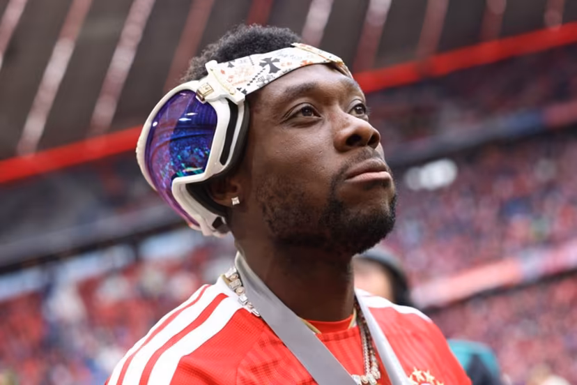 Bayern Munich's Canadian defender #19 Alphonso Davies looks on with sunglasses on the back of his head during celebrations for the Bundesliga trophy after the German first division Bundesliga football match between FC Bayern Munich and FC Cologne in Munich, southern Germany, on May 16, 2026. Alexandra BEIER / AFP
