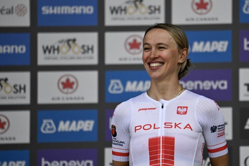 Second-placed Katarzyna Niewiadoma of Poland smiles on the podium after the Women's Elite Road Race at the 2026 Union Cycliste Internationale (UCI) Road World Championships in Montreal, Quebec, on September 26, 2026. Andrej Ivanov / AFP
