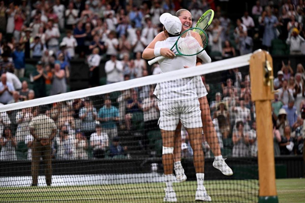 El Salvador's Marcelo Arevalo and Latvia's Jelena Ostapenko celebrate winning against Australia's players Marc Polmans and Storm Hunter during their mixed's doubles final tennis match on the eleventh day of the 2026 Wimbledon Championships at The All England Lawn Tennis and Croquet Club in Wimbledon, southwest London, on July 9, 2025. Kirill KUDRYAVTSEV / AFP