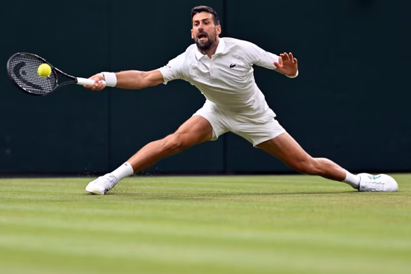 Serbia's Novak Djokovic returns the ball to Greece's Stefanos Tsitsipas during their men's singles second round tennis match on the third day of the 2026 Wimbledon Championships at The All England Lawn Tennis and Croquet Club in Wimbledon, southwest London, on July 1, 2026. Kirill KUDRYAVTSEV / AFP