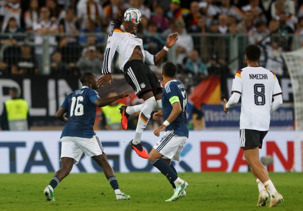 Germany's defender #02 Yann Aurel Bisseck heads the ball during the UEFA Nations League Group A2 between Germany and Greece in Augsburg, southern Germany on September 27, 2026. Michaela STACHE / AFP