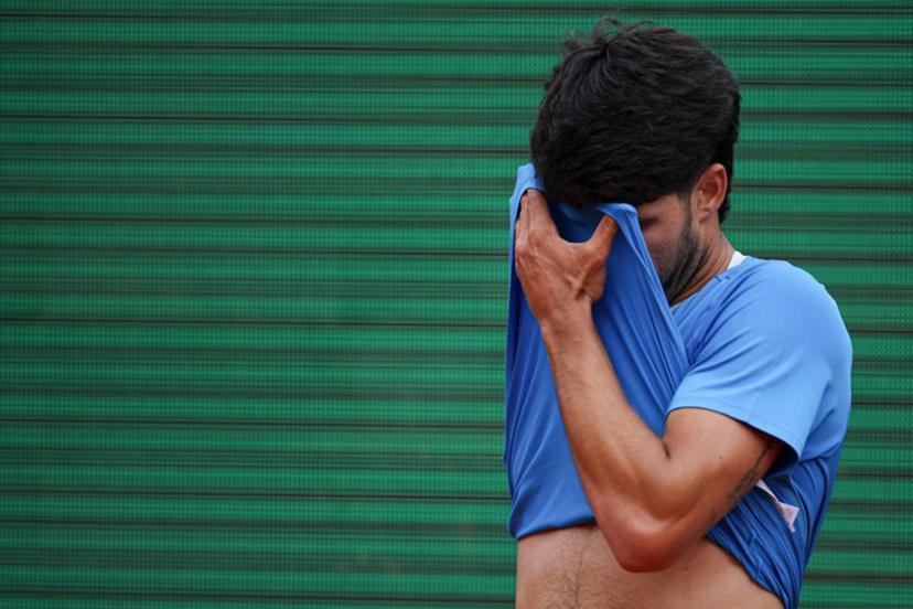 Spain's Carlos Alcaraz reacts as he plays against Italy's Jannik Sinner during the Monte Carlo ATP Masters Series Tournament final tennis match on Court Rainier III at the Monte-Carlo Country Club in Roquebrune-Cap-Martin, south-eastern France on April 12, 2026. Valery HACHE / AFP