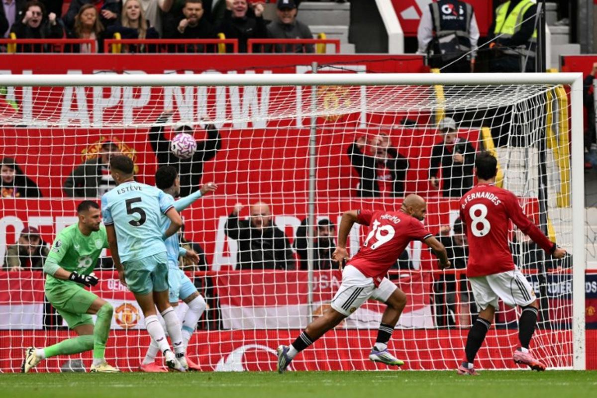 Manchester United's Cameroonian midfielder #19 Bryan Mbeumo (2R) wheels away to celebrate scoring their second goal during the English Premier League football match between Manchester United and Burnley at Old Trafford in Manchester, north west England, on August 30, 2025. Oli SCARFF / AFP