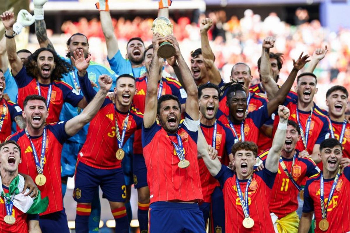 Spain's midfielder #16 Rodri lifts the trophy with his teammates after winning the 2026 World Cup football tournament final match between Spain and Argentina at the New York/New Jersey Stadium in East Rutherford on July 19, 2026. FRANCK FIFE / AFP