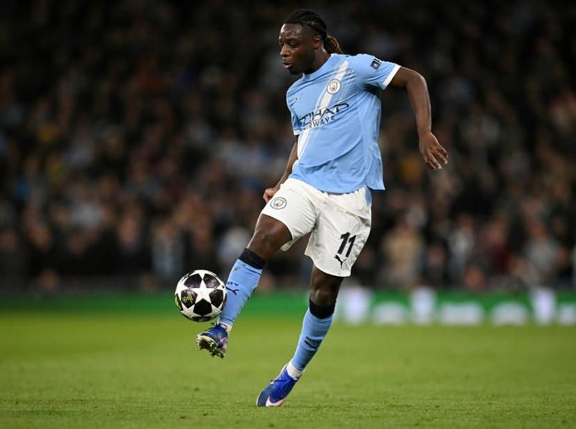 Manchester City's Belgian midfielder #11 Jeremy Doku controls the ball during the UEFA Champions League, round of 16 second leg football match between Manchester City and Real Madrid at the Etihad Stadium in Manchester, north west England, on March 17, 2026. Oli SCARFF / AFP
