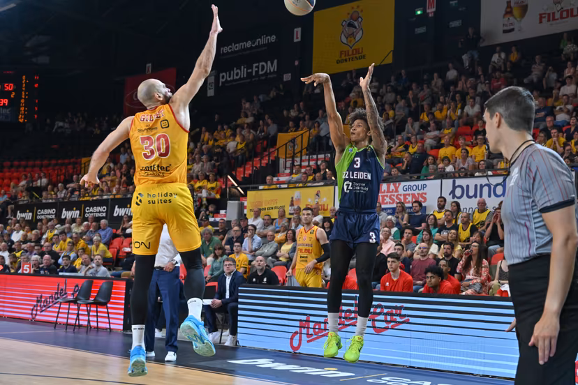 Oostende's Pierre-Antoine Gillet defending on shooting Leiden's Deion Hammond during a basketball match between Belgian BC Oostende and Dutch team ZZ Leiden, Friday 09 June 2023 in Oostende, the first match in the best-of-three finals of the 'BNXT League' basket championship. BELGA PHOTO DAVID CATRY
