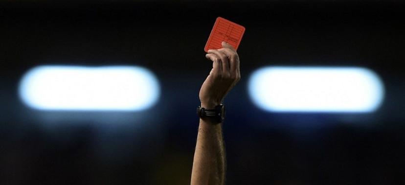 The hand of Argentine referee Diego Abal showing the red card to Rosario Central's defender Lucas Acevedo (not in frame) during their Copa Sudamericana 2014 second round second leg football match against Boca Juniors at the Bombonera stadium in Buenos Aires, Argentina, on September 18, 2014. AFP PHOTO / Juan Mabromata Juan MABROMATA / AFP