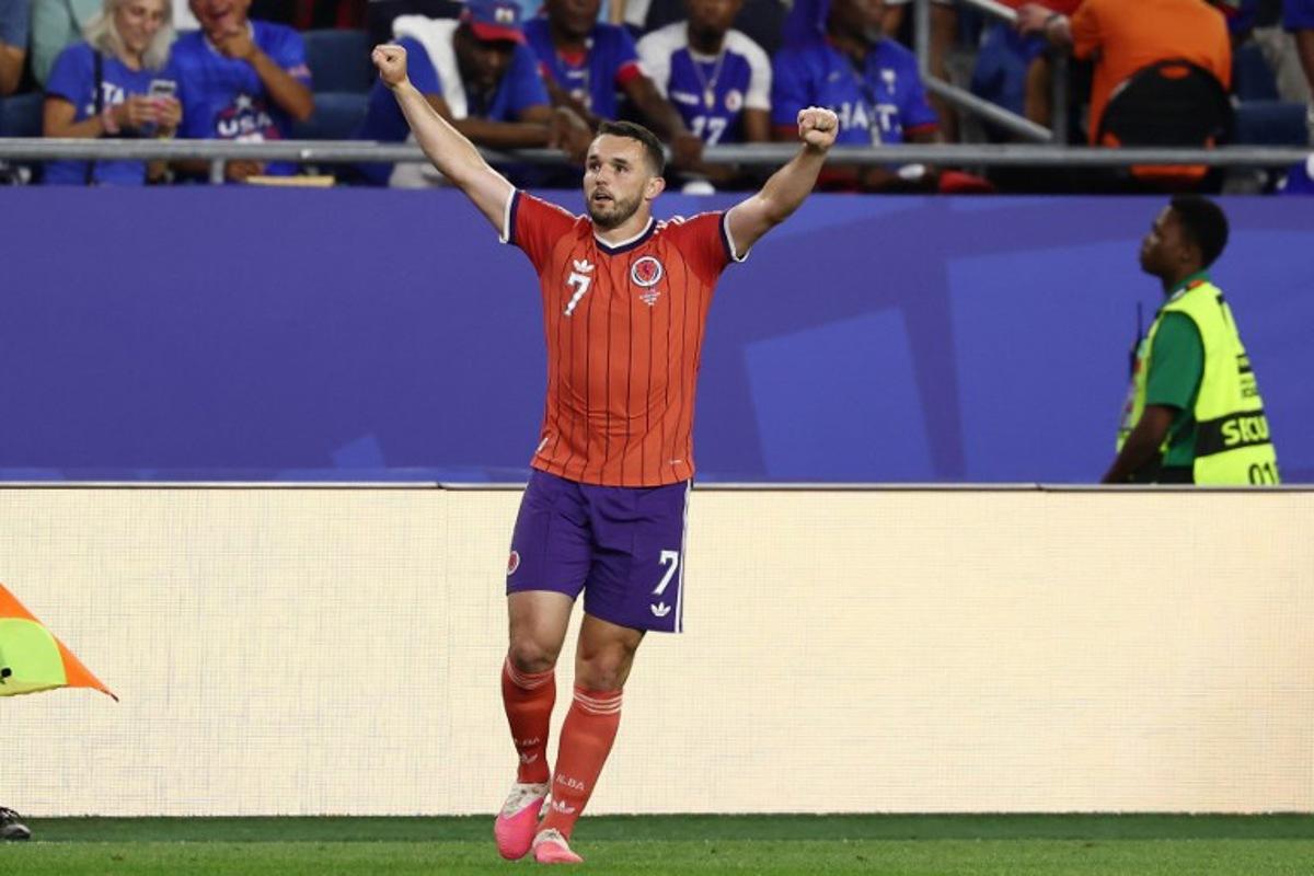 Scotland's midfielder #07 John McGinn celebrates after scoring his team's first goal during the 2026 World Cup Group C football match between Haiti and Scotland at the Boston Stadium in Foxborough on June 13, 2026. FRANCK FIFE / AFP