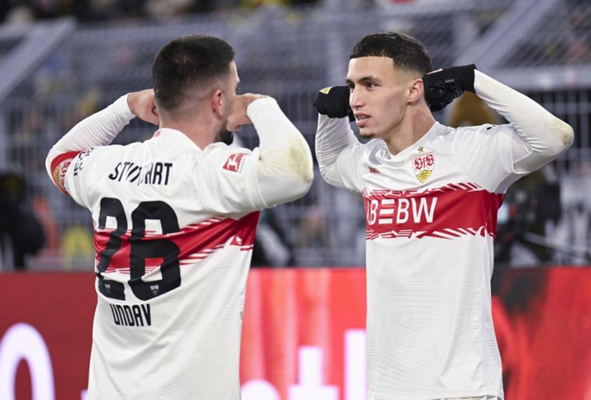 Stuttgart's German forward #26 Deniz Undav (L) celebrates scoring with Stuttgart's German-Marrocan forward #11 Bilal El Khannouss during the German first division Bundesliga football match between Borussia Dortmund and VfB Stuttgart in Dortmund on November 22, 2025. INA FASSBENDER / AFP