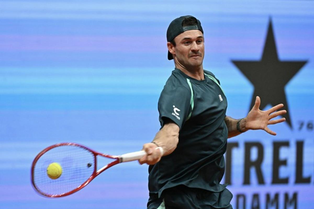 USA's Tommy Paul returns a shot to Argentina's Thiago Tirante during their 2026 ATP Tour Madrid Open tennis tournament second round singles match at the Caja Magica in Madrid, on April 24, 2026. Javier SORIANO / AFP