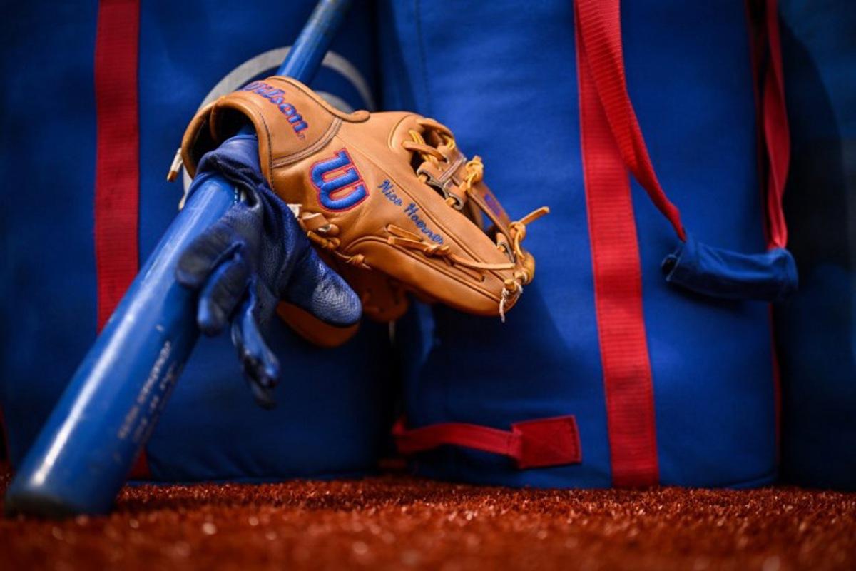 The glove and bat of Chicago Cubs' Nico Hoerner are pictured prior to the first of the two-game, 2023 major league baseball London Series between the St. Louis Cardinals and the Chicago Cubs at London Stadium in east London on June 24, 2023. Ben Stansall / AFP