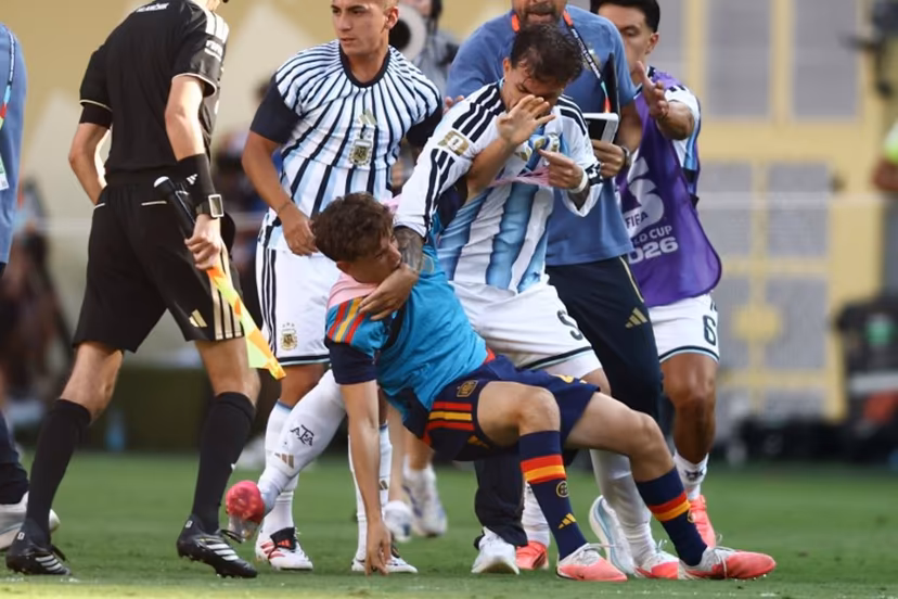 (FILES) Argentina's midfielder #05 Leandro Paredes (top) clashes with Spain's midfielder #09 Gavi during the 2026 World Cup football tournament final match between Spain and Argentina at the New York/New Jersey Stadium in East Rutherford on July 19, 2026. FIFA announced on July 29, 2026 that it had opened proceedings into some Argentina players for their behaviour after losing the World Cup to Spain. A handful of Argentina players and staff confronted their Spanish rivals after the final whistle of the final in New York which Spain won 1-0 after extra time. Argentina players including Nahuel Molina, Thiago Almada and Leandro Paredes, as well as Argentinian official Roberto Ayala, were involved in the incidents, as was Spain's Pablo Martin Paez Gavira. CHARLY TRIBALLEAU / AFP