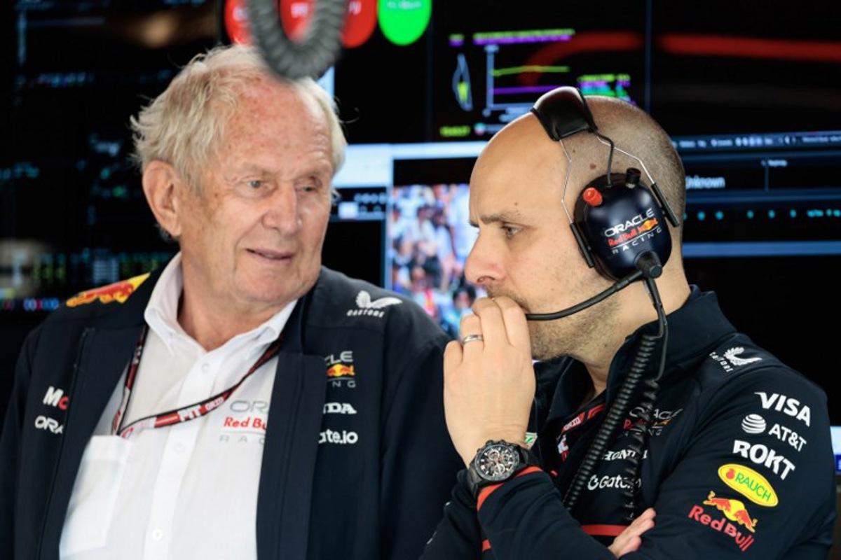(L/R) Oracle Red Bull Racing special advisor Helmut Markro and Oracle Red Bull Racing engineer Gianpiero Lambiase speak with each other during the qualifying session for the 2025 Formula 1 Grand Prix du Canada at Circuit Gilles-Villeneuve in Montreal, Canada, on June 14, 2025. SHAWN THEW / POOL / AFP