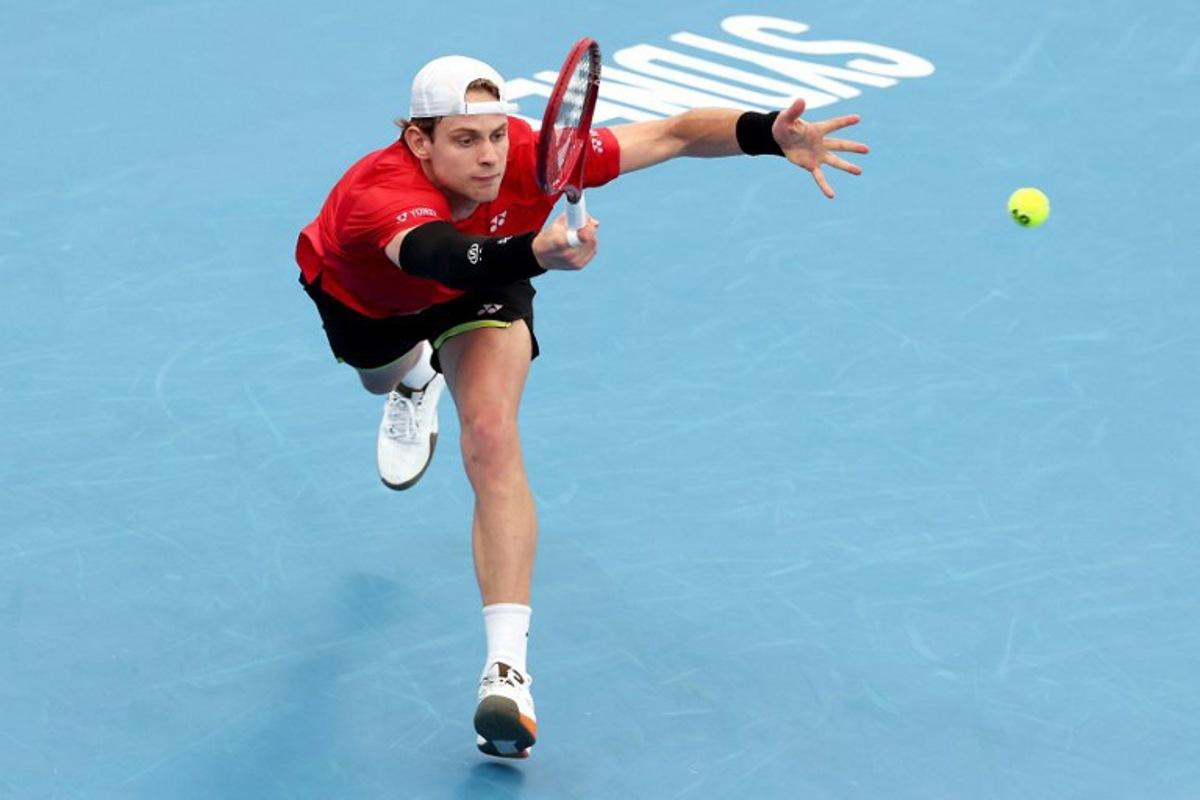 Belgium's Zizou Bergs hits a return to China's Zhang Zhizhen during their men's singles match at the United Cup tennis tournament on Ken Rosewall Arena in Sydney on January 3, 2026. DAVID GRAY / AFP