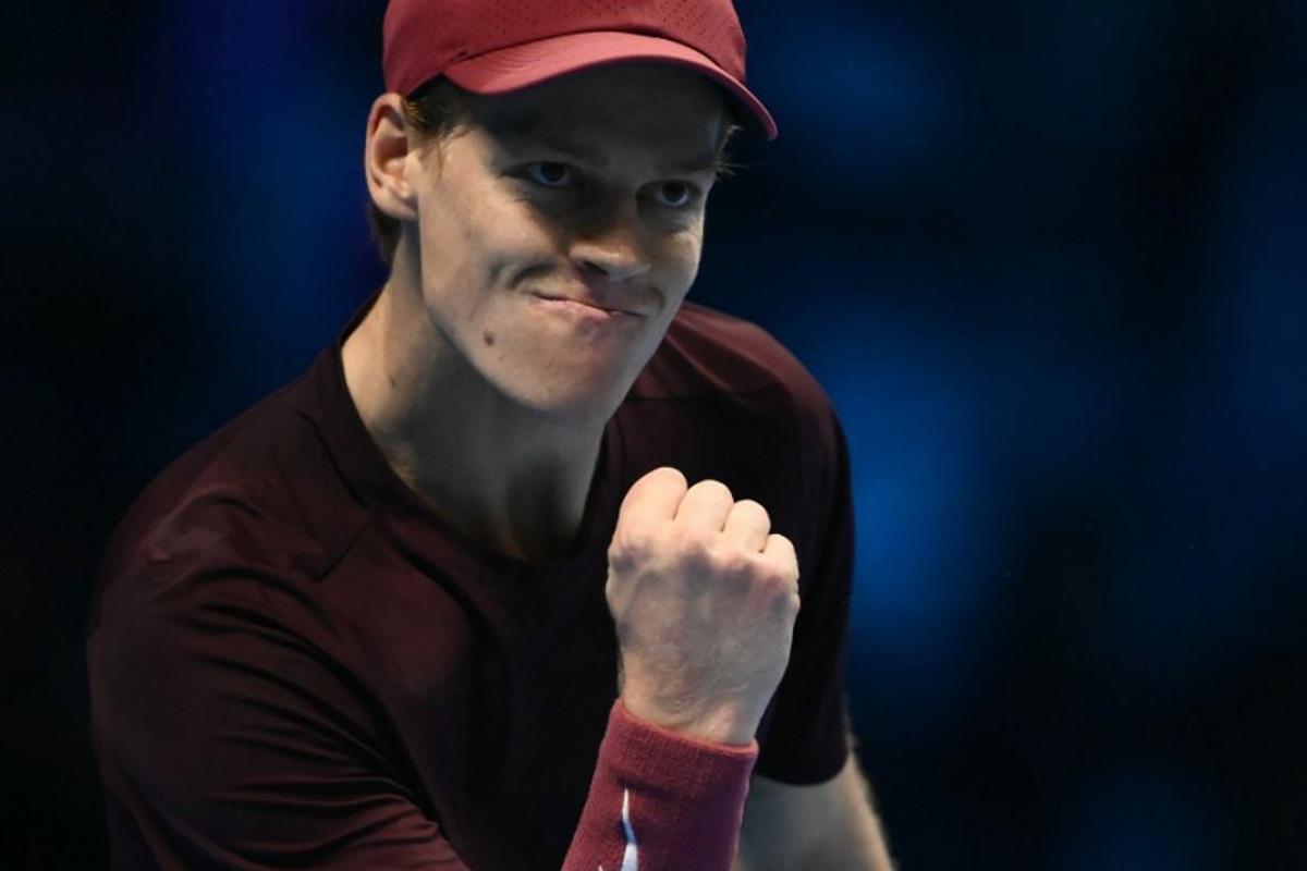 Italy's Jannik Sinner reacts during his match against Canada's Felix Auger-Aliassime at the ATP Finals tennis tournament in Turin on November 10, 2025. Marco BERTORELLO / AFP