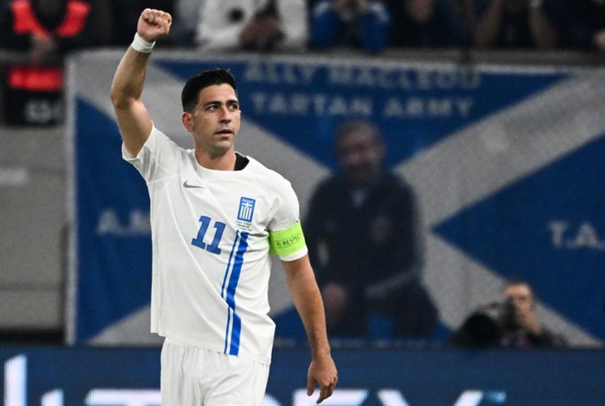 Greece's midfielder #11 Tasos Bakasetas celebrates after scoring his team's first goal during the FIFA World Cup 2026 Group C European qualification football match between Greece and Scotland at the Karaiskakis Stadium in Piraeus, on November 15, 2025. Angelos TZORTZINIS / AFP