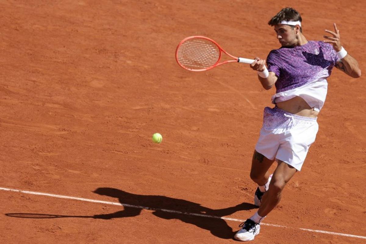 Italy's Flavio Cobolli plays a forehand return to US Zachary Svajda during their men's singles match on day 9 of the French Open tennis tournament on Court Philippe-Chatrier at the Roland-Garros Complex in Paris on June 1, 2026. Thomas SAMSON / AFP