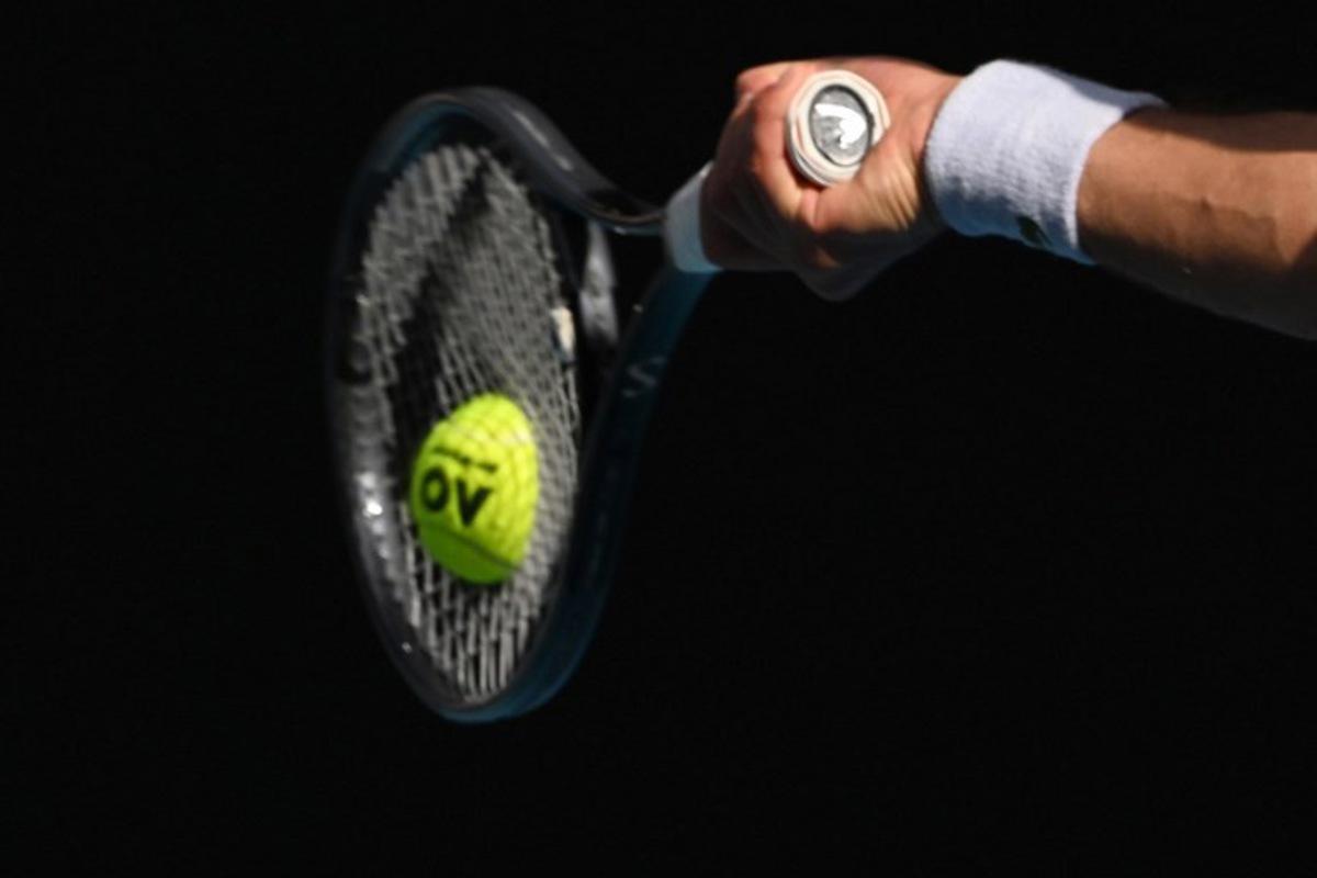 Serbia's Novak Djokovic hits a return against USA's Taylor Fritz during their men's singles quarter-final match on day 10 of the Australian Open tennis tournament in Melbourne on January 23, 2024. Paul Crock / AFP
