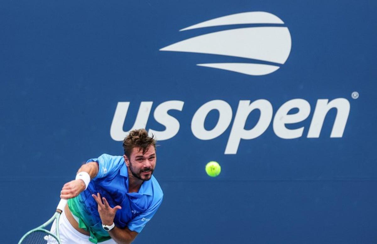 Switzerland's Stan Wawrinka serves to Italy's Matteo Berrettini in their men's singles first round tennis match on day two of the US Open tennis tournament at the USTA Billie Jean King National Tennis Center in New York City on August 31, 2026. KENA BETANCUR / AFP