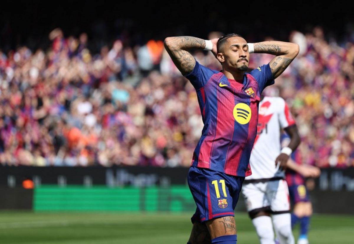 Barcelona's Brazilian forward #11 Raphinha reacts during the Spanish league football match between FC Barcelona and Rayo Vallecano de Madrid at Camp Nou Stadium in Barcelona on March 22, 2026. Josep LAGO / AFP