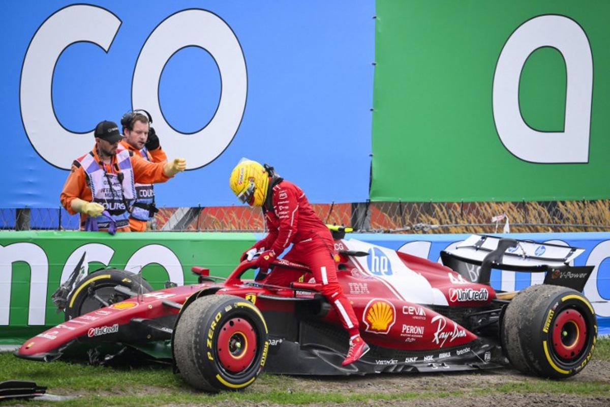 Ferrari's British driver Lewis Hamilton exits his car after crashing during the Formula One Dutch Grand Prix at The Circuit Zandvoort, western Netherlands, on August 31, 2025. JOHN THYS / AFP