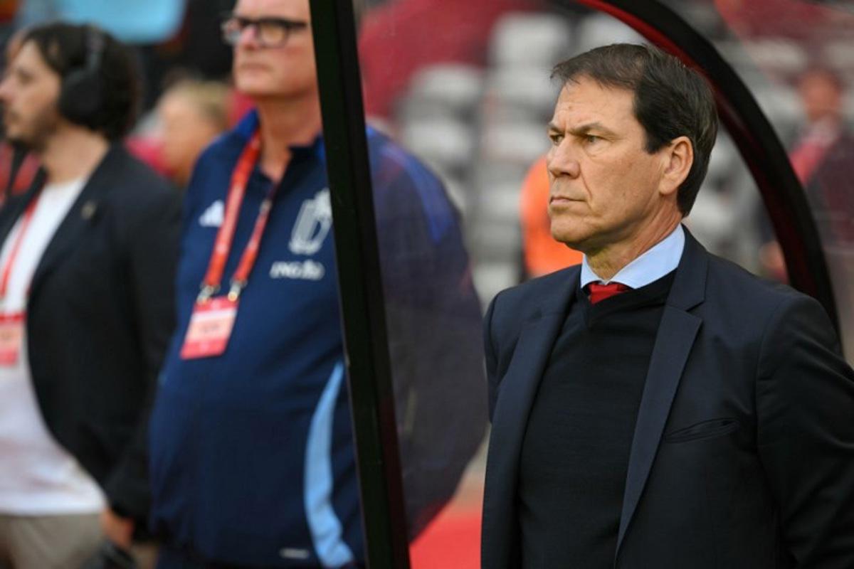 Belgium's French head coach Rudi Garcia (R) stands for the National Anthems ahead of the FIFA World Cup 2026 Group J European qualification football match between Belgium and Wales at the King Baudouin Stadium in Brussels, on June 9, 2025. NICOLAS TUCAT / AFP