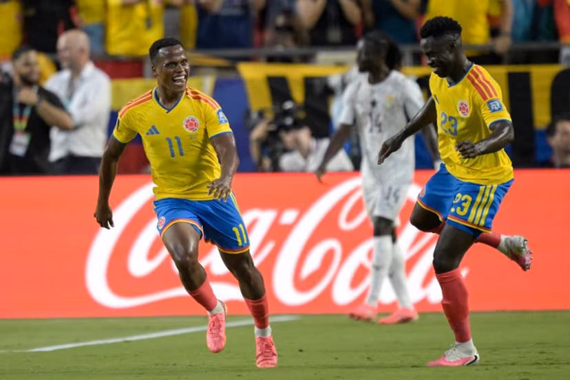 Colombia's midfielder #11 Jhon Arias (R) celebrates scoring his team's first goal with defender #23 Davinson Sanchez during the 2026 World Cup round of 32 football match between Colombia and Ghana at the Kansas City Stadium in Kansas City on July 3, 2026. JUAN MABROMATA / AFP