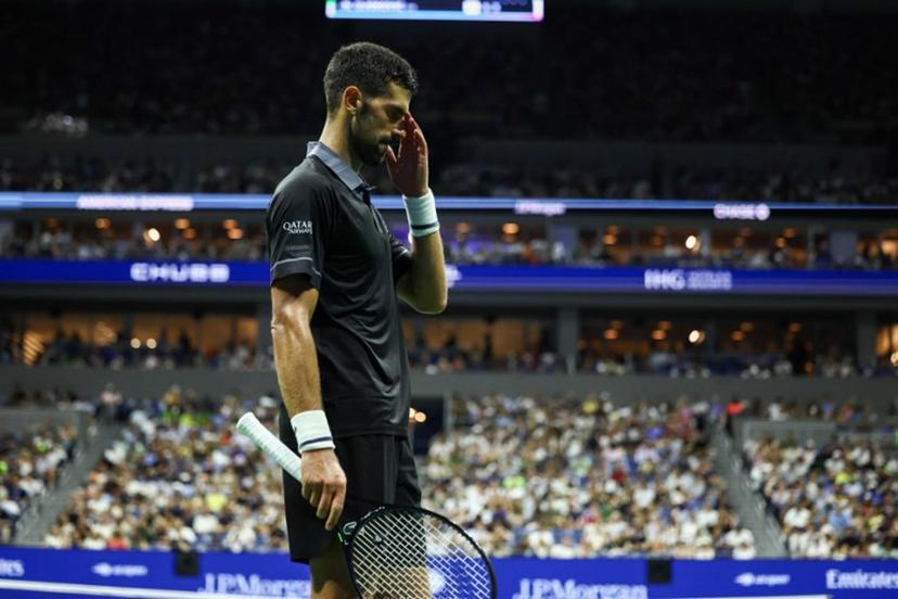 Serbia's Novak Djokovic reacts during a match against Argentina's Mariano Navone during the men's singles first round tennis match on day one of the US Open tennis tournament at the USTA Billie Jean King National Tennis Center in New York City on August 30, 2026. CHARLY TRIBALLEAU / AFP