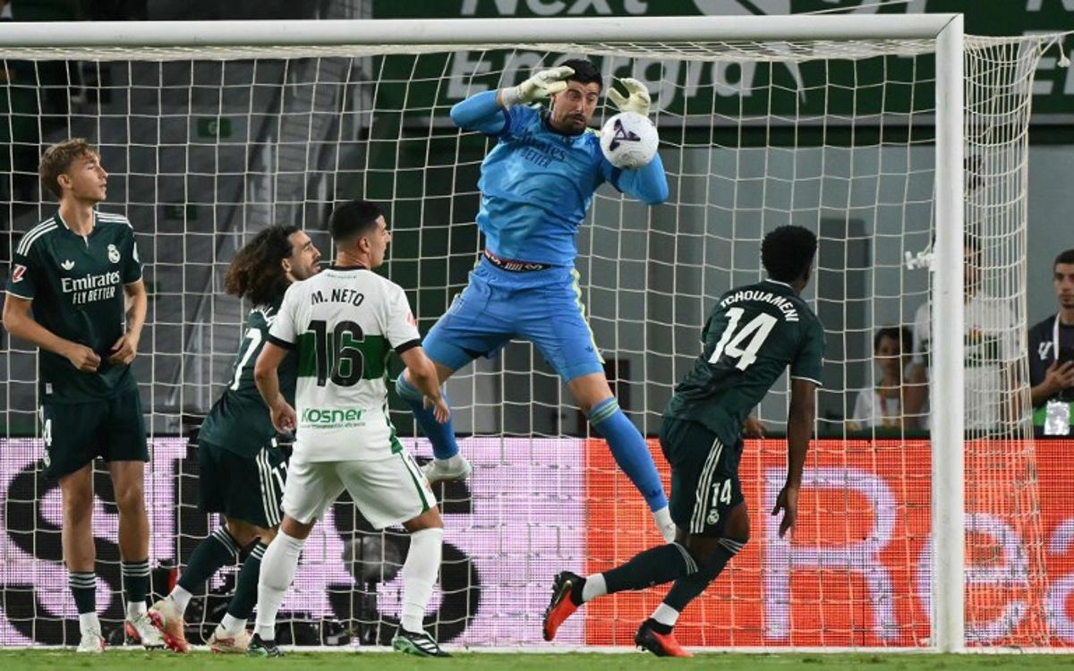 Real Madrid's Belgian goalkeeper #01 Thibaut Courtois makes a save during the Spanish league football match between Elche CF and Real Madrid CF at Martinez Valero Stadium in Elche on September 15, 2026. JOSE JORDAN / AFP