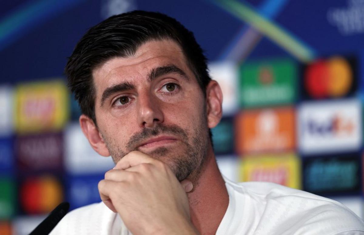 Real Madrid's Belgian goalkeeper #01 Thibaut Courtois looks on during a press conference on the eve of the UEFA Champions League football match between Real Madrid CF and Juventus at the Real Madrid Sports City in Valdebebas, in the outskirts of Madrid on October 21, 2025. Thomas COEX / AFP