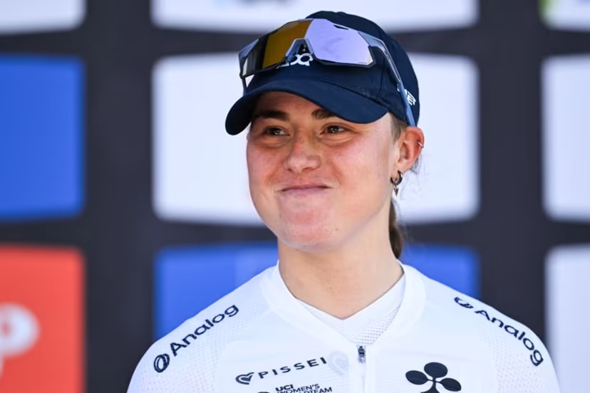 Third-placed UAE Team ADQ's Spanish Paula Blasi celebrates on the podium after 'La Fleche Wallonne' one day cycling race, 141 km from Huy to Huy, on April 22, 2026. JOHN THYS / AFP