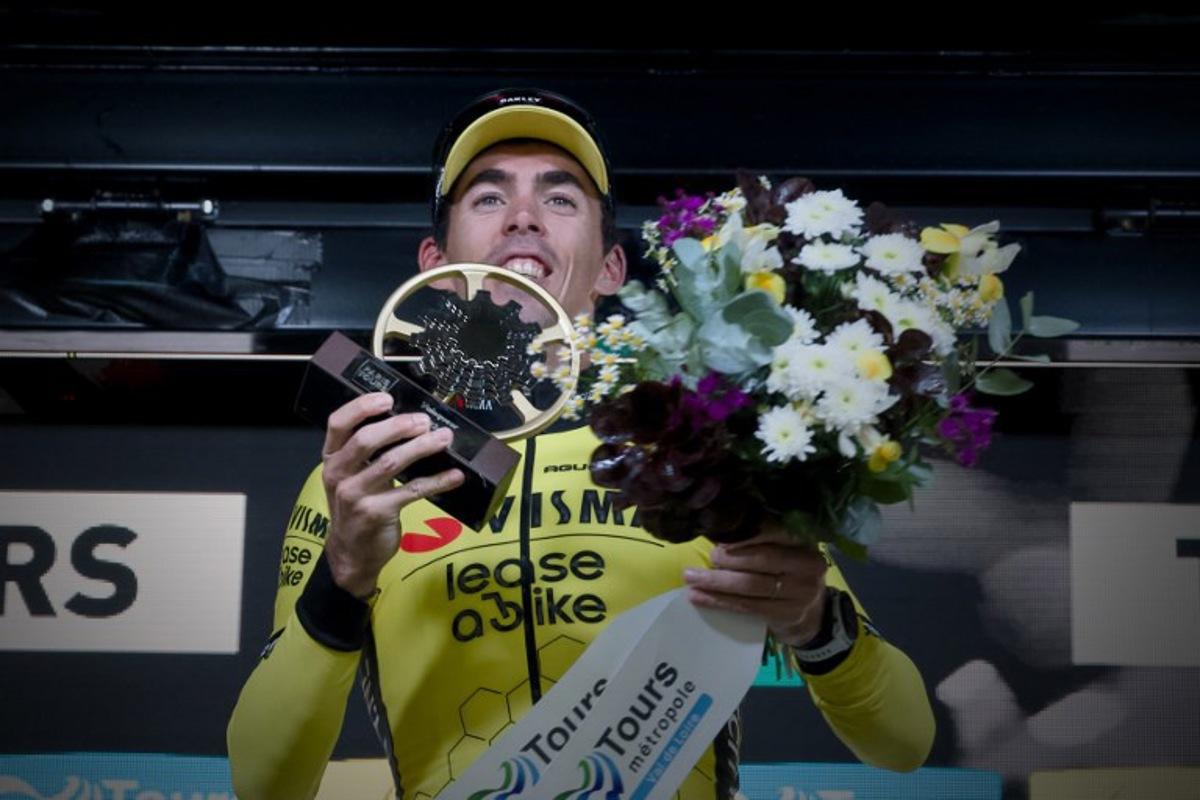 French rider of team Visma Lease A Bike Christophe Laporte celebrates on the podium after winning the 118th edition of the 213,9 km Paris-Tours one day cycling race, in Tours, central France on October 6, 2024. GUILLAUME SOUVANT / AFP