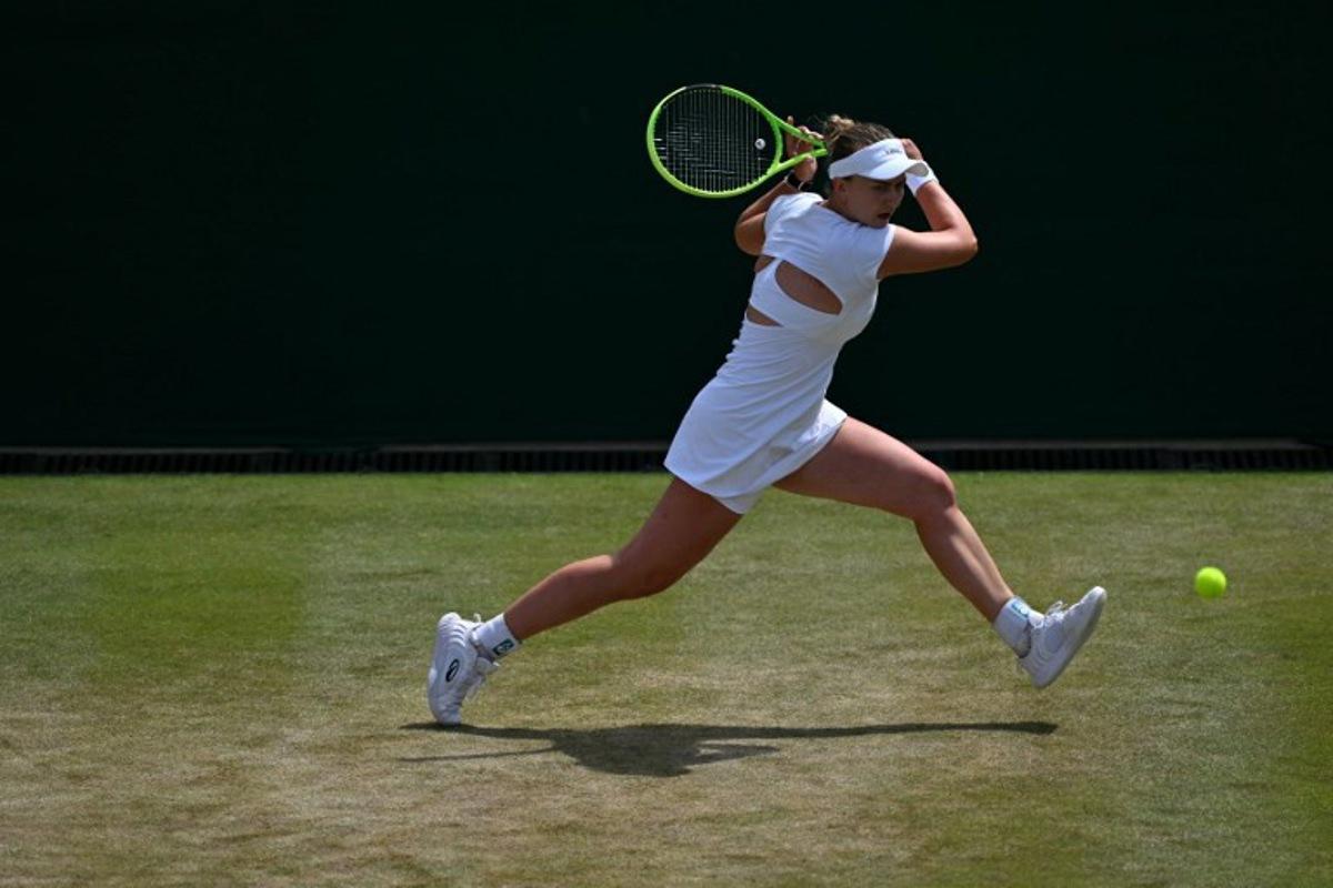 Czech Republic's Barbora Krejcikova returns to Czech Republic's Karolina Muchova during their women's singles round of sixteen tennis match on the seventh day of the 2026 Wimbledon Championships at The All England Lawn Tennis and Croquet Club in Wimbledon, southwest London, on July 5, 2026. Glyn KIRK / AFP